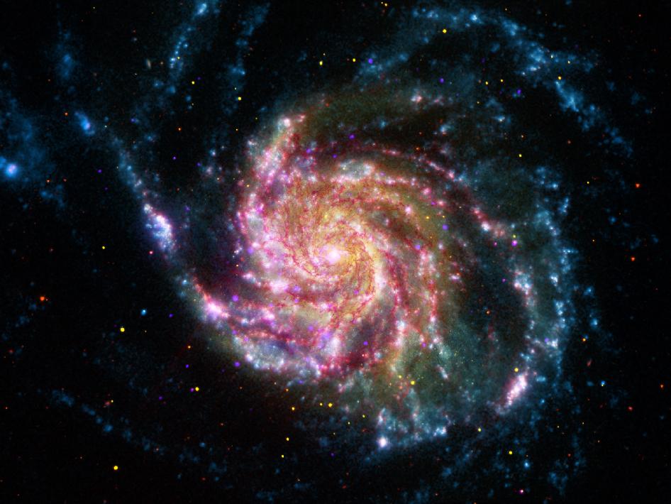 La Galaxia del Molinete se muestra como una espiral de arcoiris en nuevas fotos | Teinteresa
